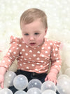 Baby Model Lake in the “Hearts and Ruffles" Ribbed Bodysuit