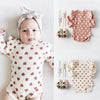 Baby Model Lake in the “Hearts and Ruffles" Ribbed Bodysuit